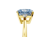 Yellow gold Fancy Blue Radiant  Cut Three-Stone Solitaire Ring with Round Accent Diamonds and Four-Prong Setting_25
