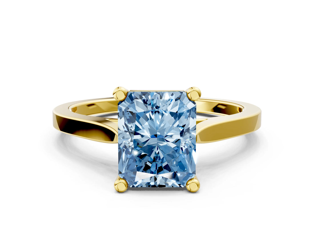 Yellow gold Fancy Blue Radiant  Solitaire Diamond Ring with Four-Prong Setting and Tapered Band
