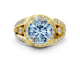 Yellow gold Fancy Blue Round Cut Diamond Halo Ring with Split Shank and Bezel Accents and Four-Prong Setting