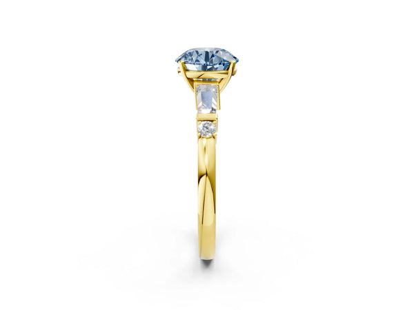 Yellow gold Fancy Blue Round  Cut Diamond Ring with Baguette Side Stones, Channel Set Band, and Four-Prong Setting