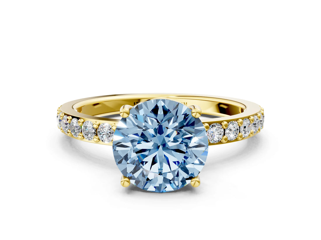 Yellow gold Fancy Blue Round  Cut Diamond Solitaire with Pave Band and Four-Prong Setting
