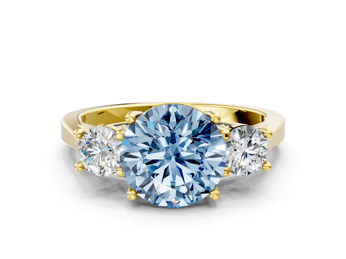 Yellow gold Fancy Blue Round Cut Diamond Three-Stone Engagement Ring with Prong Setting and Pavé Band