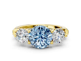 Yellow gold Fancy Blue Round Cut Diamond Three-Stone Ring with Prong Setting and Pavé Band