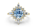 Yellow gold Fancy Blue Round Cut Halo Diamond Cluster Ring with Marquise and Round Stones on a White Gold Band with Prong Setting
