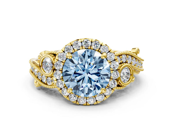 Yellow gold Fancy Blue Round Cut Halo Diamond Ring with Milgrain and Bezel Accents on a Split Shank Band