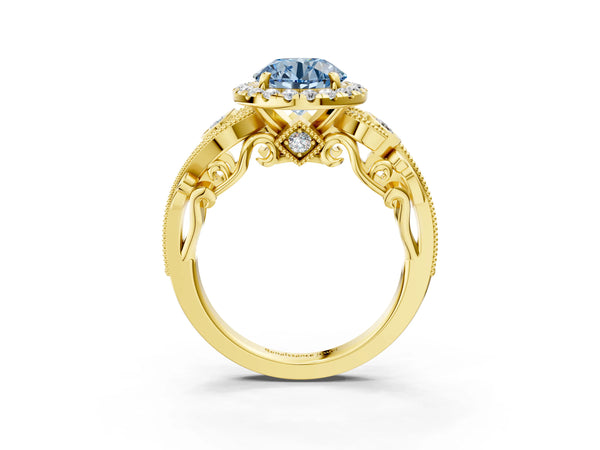 Yellow gold Fancy Blue Round Cut Halo Diamond Ring with Milgrain and Bezel Accents on a Split Shank Band