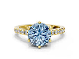 Yellow gold Fancy Blue Round Cut Solitaire Diamond Engagement Ring with Pavé Band and Six-Prong Setting