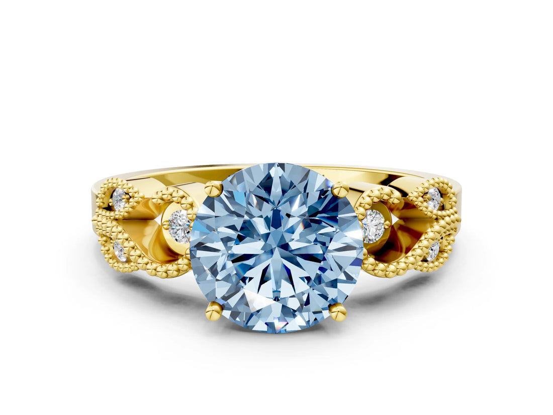 Yellow gold Fancy Blue Round Cut Solitaire Milgrain Leaf Band with Prong Setting