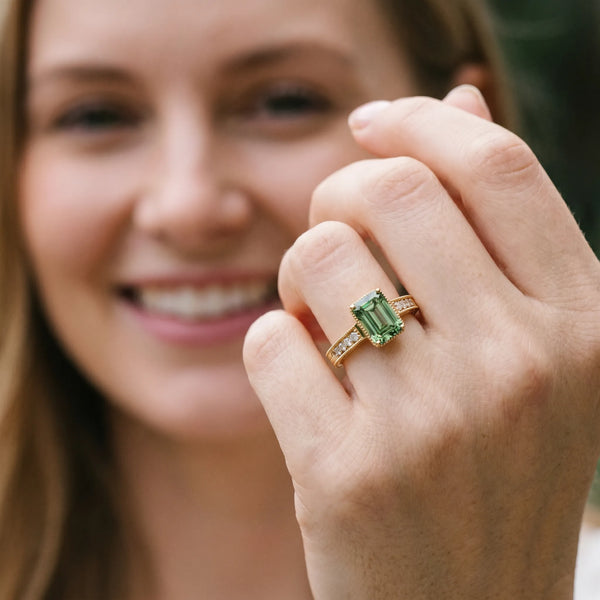 Yellow gold Fancy Green Emerald Cut Diamond Engagement Ring with Milgrain Channel Set Band and Prong Setting