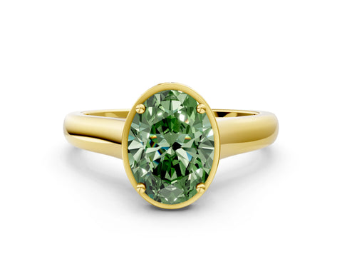 Yellow gold Fancy Green Oval Cut Solitaire Diamond Engagement Ring with Four-Prong Setting and Tapered Band