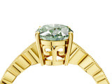 Yellow gold Fancy Green Oval Cut Solitaire Diamond Ring with Infinity Twist Band and Four-Prong Setting_4