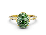 Yellow gold Fancy Green Oval Cut Solitaire Split Shank Pave Diamond Engagement Ring with Four-Prong Setting