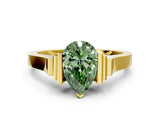 Yellow gold Fancy Green Pear Cut Brilliant Solitaire Diamond Ring with Channel Set Band and Bar Prong Setting