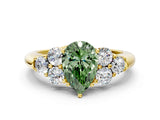Yellow gold Fancy Green Pear  Cut Diamond Cluster Ring with Round Accent Stones and Prong Setting on a Classic Band_51