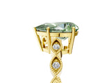 Yellow gold Fancy Green Pear Cut Solitaire Diamond Ring with Infinity Twist Band and Four-Prong Setting_5