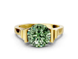Yellow gold Fancy Green Round Cut Brilliant Solitaire Diamond Ring with Channel Set Band and Bar Prong Setting
