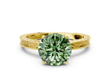 Yellow gold Fancy Green Round Cut Solitaire Milgrain Engraved Band with Four-Prong Setting