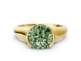 Yellow gold Fancy Green Round Cut Solitaire Tension Set Diamond Ring with Split Shank Band