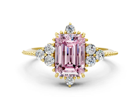 Yellow gold Fancy Pink Emerald Cut Brilliant Diamond with Cluster Setting on a Beaded Band and Four-Prong Setting
