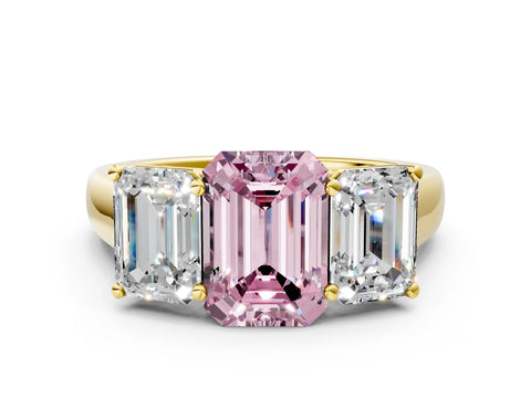 Yellow gold Fancy Pink Emerald Cut Three-Stone Diamond Ring with Prong Setting on a Classic Band