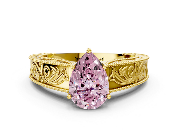 Yellow gold Fancy Pink Pear Cut Diamond Solitaire Ring with Engraved Band and Four-Prong Setting