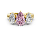 Yellow gold Fancy Pink Pear Cut Three-Stone Diamond Ring with Prong Setting on a Classic Band_12