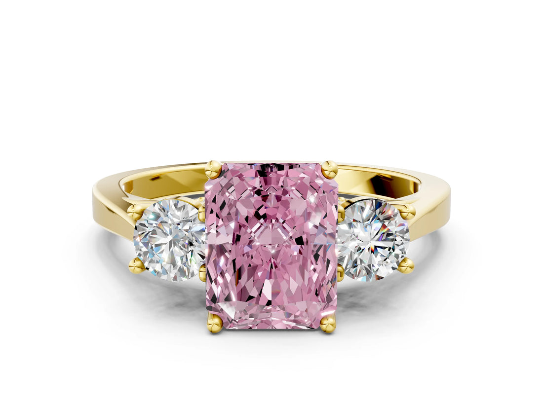 Yellow gold Fancy Pink Radiant Cut Diamond Three-Stone Engagement Ring with Prong Setting and Pavé Band