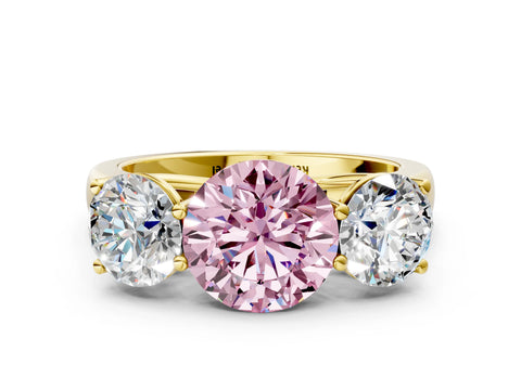 Yellow gold Fancy Pink Round Cut Three-Stone Diamond Ring with Prong Setting on a Classic Band