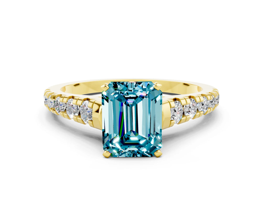Yellow gold Fancy White Emerald Cut Blue Topaz Solitaire Ring with Cathedral Setting and Pavé Band