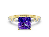 Yellow gold Fancy White Princess Cut Tanzanite Solitaire with Side Stones on a Pavé Band and Four-Prong Setting