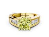 Yellow gold Fancy Yellow Cushion Cut Cut Channel Set Solitaire Ring with Four-Prong Setting