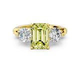 Yellow gold Fancy Yellow Emerald Cut Diamond Three-Stone Ring with Prong Setting and Pavé Band