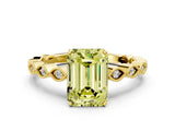 Yellow gold Fancy Yellow Emerald Cut Solitaire Diamond Ring with Infinity Twist Band and Four-Prong Setting