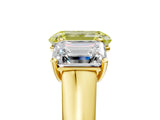Yellow gold Fancy Yellow Emerald Cut Three-Stone Diamond Ring with Prong Setting on a Classic Band_17