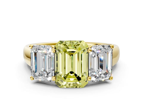 Yellow gold Fancy Yellow Emerald Cut Three-Stone Diamond Ring with Prong Setting on a Classic Band