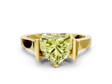Yellow gold Fancy Yellow Heart Cut Brilliant Solitaire Diamond Ring with Channel Set Band and Bar Prong Setting