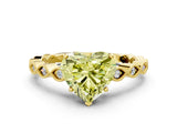 Yellow gold Fancy Yellow Heart Cut Solitaire Diamond Ring with Infinity Twist Band and Four-Prong Setting