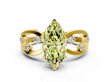 Yellow gold Fancy Yellow Marquise  Cut Solitaire Diamond with Side Stones on Criss-Cross Band and Four-Prong Setting
