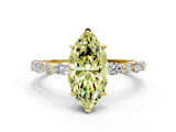 Yellow gold Fancy Yellow Marquise  Solitaire with Side Stones on a Pavé Band and Four-Prong Setting