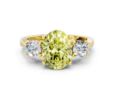Yellow gold Fancy Yellow Oval Cut Diamond Three-Stone Engagement Ring with Prong Setting and Pavé Band