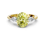Yellow gold Fancy Yellow Oval Cut Diamond Three-Stone Ring with Pear Side Stones and Four-Prong Setting_96