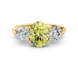 Yellow gold Fancy Yellow Oval Cut Diamond Three-Stone Ring with Prong Setting and Pavé Band