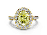 Yellow gold Fancy Yellow Oval Cut Halo Diamond Ring with Pavé Band and Three-Prong Setting