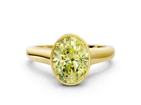 Yellow gold Fancy Yellow Oval Cut Solitaire Diamond Engagement Ring with Four-Prong Setting and Tapered Band