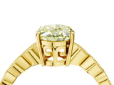 Yellow gold Fancy Yellow Oval Cut Solitaire Diamond Ring with Infinity Twist Band and Four-Prong Setting_4
