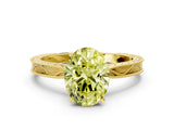 Yellow gold Fancy Yellow Oval Cut Solitaire Milgrain Engraved Band with Four-Prong Setting