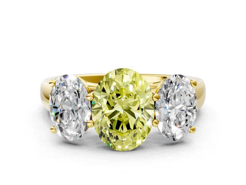 Yellow gold Fancy Yellow Oval Cut Three-Stone Diamond Ring with Prong Setting on a Classic Band