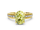 Yellow gold Fancy Yellow Oval  Solitaire Diamond Ring with Channel Set Band and Six-Prong Setting_48