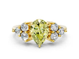Yellow gold Fancy Yellow Pear Cut Brilliant Diamond Cluster Accent Solitaire Ring with Prong Setting
