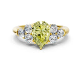 Yellow gold Fancy Yellow Pear  Cut Diamond Cluster Ring with Round Accent Stones and Prong Setting on a Classic Band_51